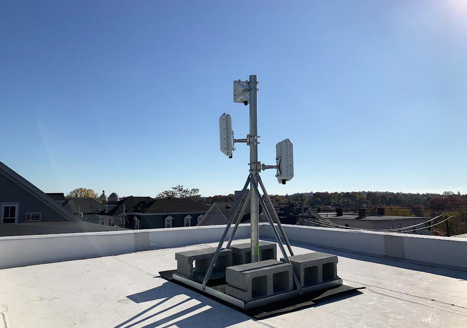 The wire mesh infrastructure for ONE Neighborhood Builders' free Internet system atop the building  at 255 Manton Ave. The system is expanding its network to reach a total of 2,000 households in Olneyville, thanks to $155,000 in new grants.